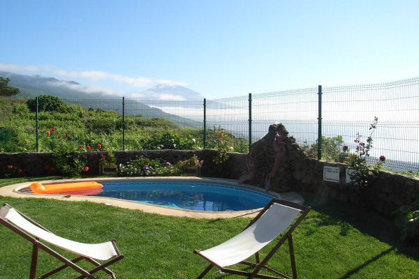 The garden and pool enjoy views of Mount Teide