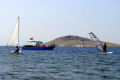Surfing and sailing in the bay