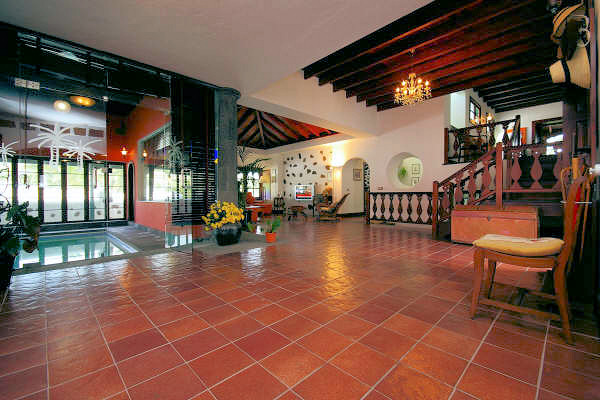 The immensely spacious open-plan interior, with the indoor pool on the left