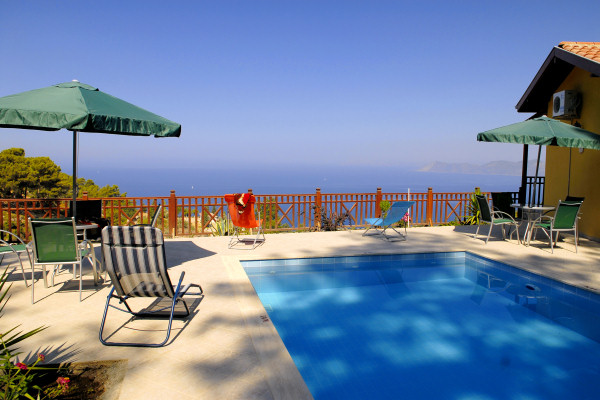 The pool and sun terrace at Selen Cottages