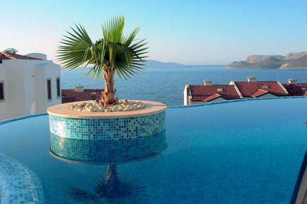 Each villa has an infinity pool with miniature palm island