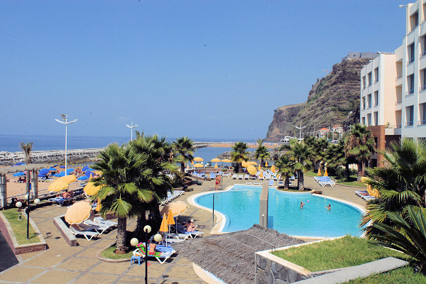 The pool terrace bordering the beach