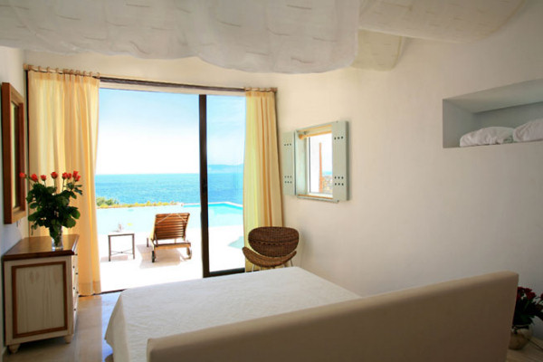 A bedroom in one of the villas