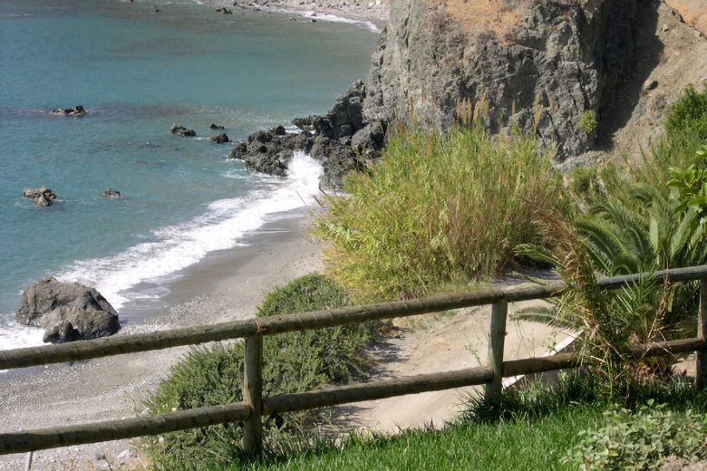 The hidden cove below the villas
