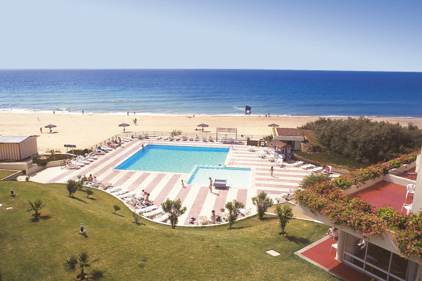 The Luamar's pool terrace borders the beach