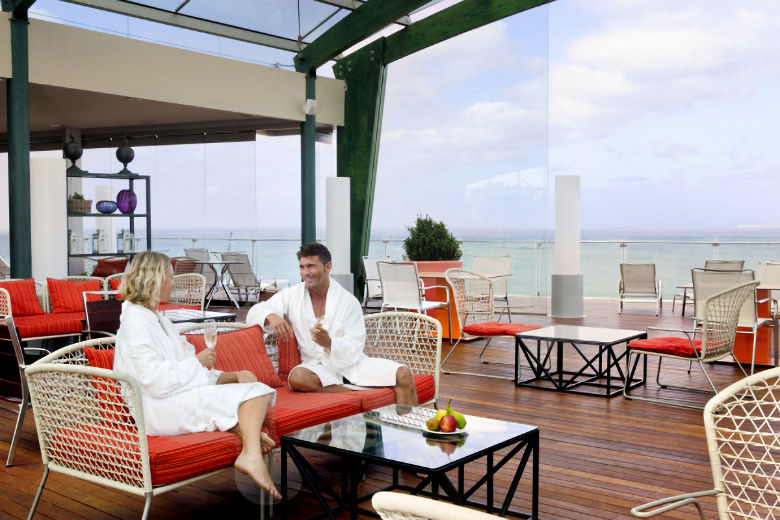 Poolside relaxation area and adjacent sun deck