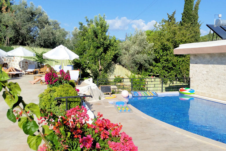 The pool and terrace at the Dardanos Hotel