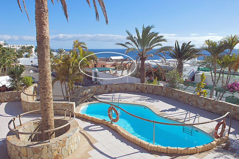 View across the pool at Garden Beach, with Rocamar circled