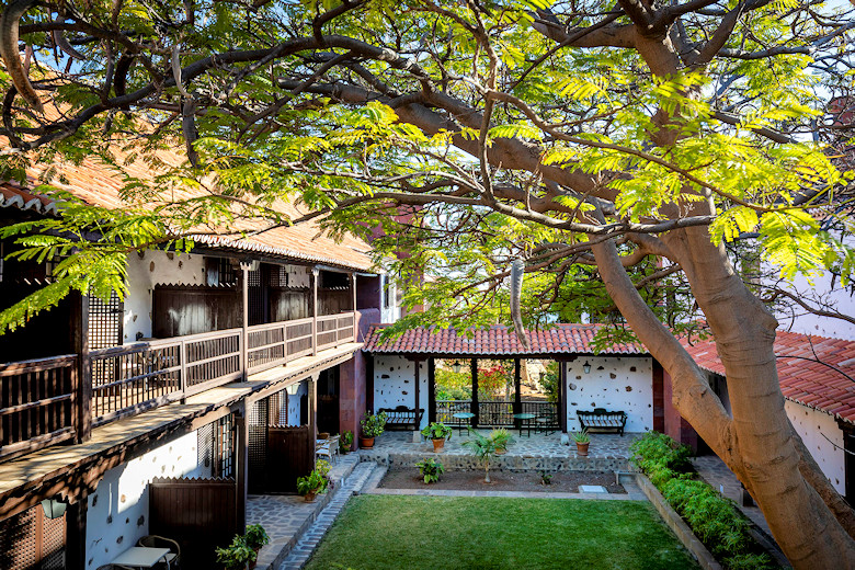 Rooms are set amongst mature gardens