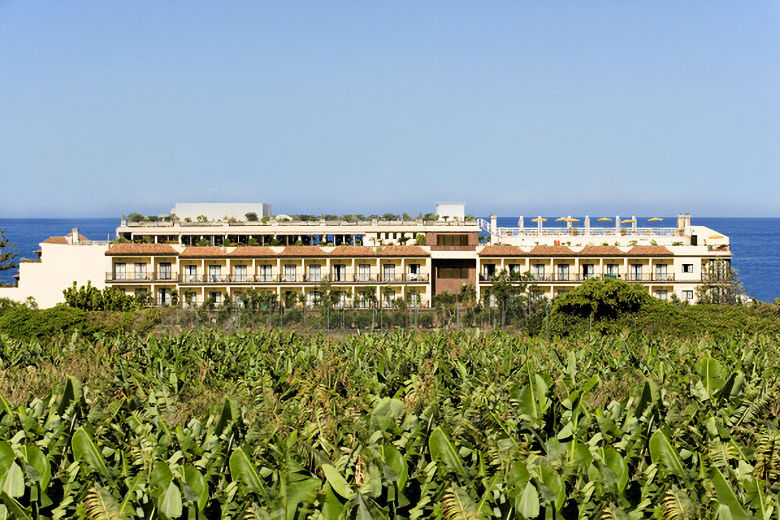 The hotel is backed by banana plantations