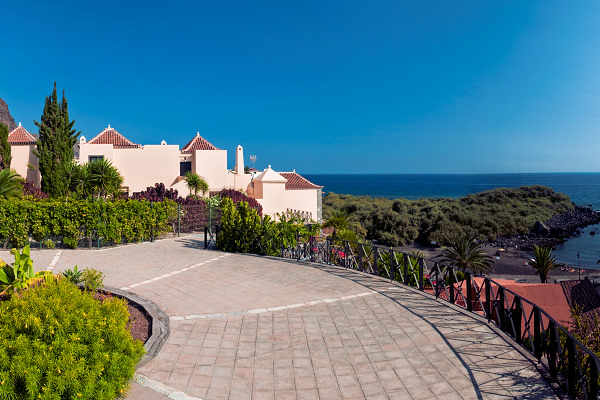 Rear view of the apartments and the small volcanic beach