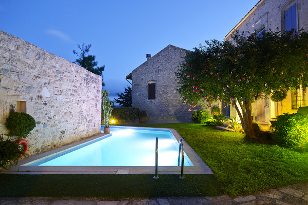 The garden and pool at dusk