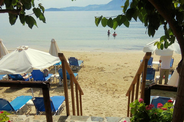 Steps leading onto the beach from the hotel's taverna