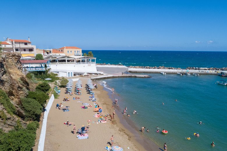 Panormo's beach and harbour with Captain's House Taverna behind
