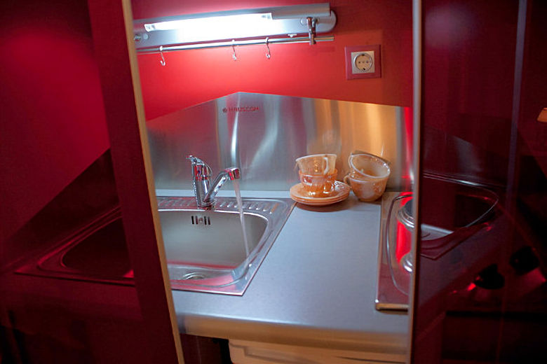 Concealed kitchenette unit in Studio Kismet