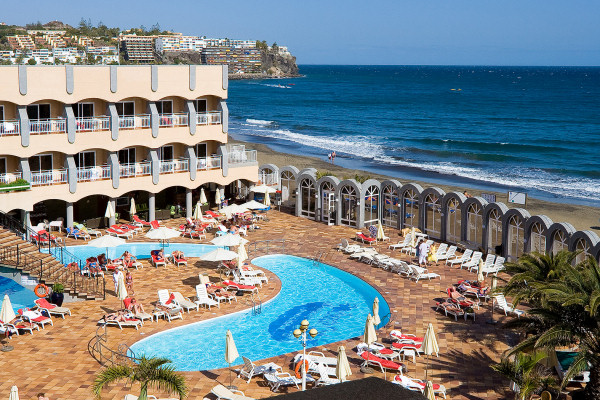 The hotel's terrace provides direct access to the beach