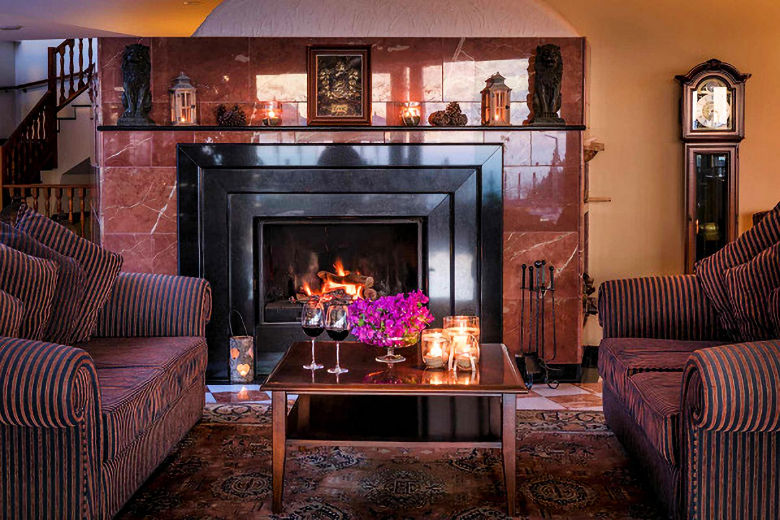 Enjoy a nightcap by the fireplace