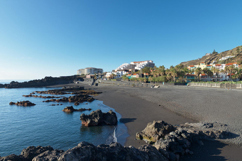 Los Cancajos volcanic beach with Hacienda San Jorge on the right