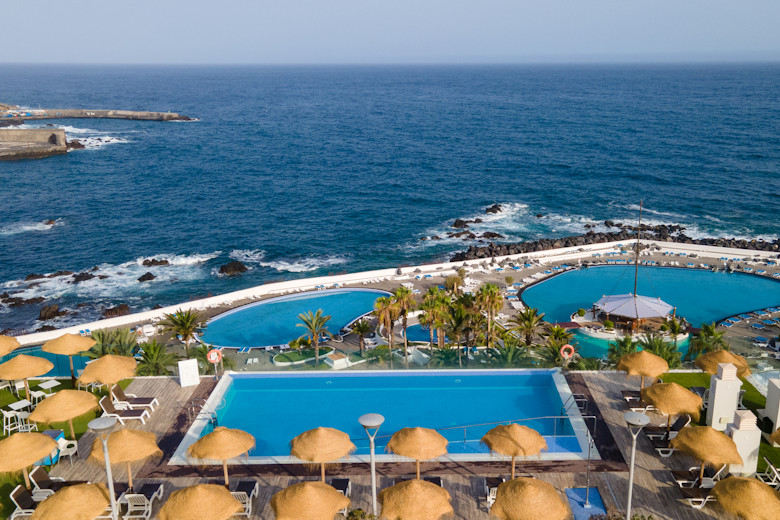 Rooftop pool and view of the public Lido Martianez opposite the hotel