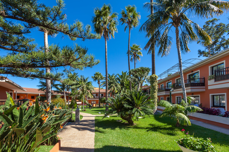 Ambassador Apartments stand in mature tropical gardens