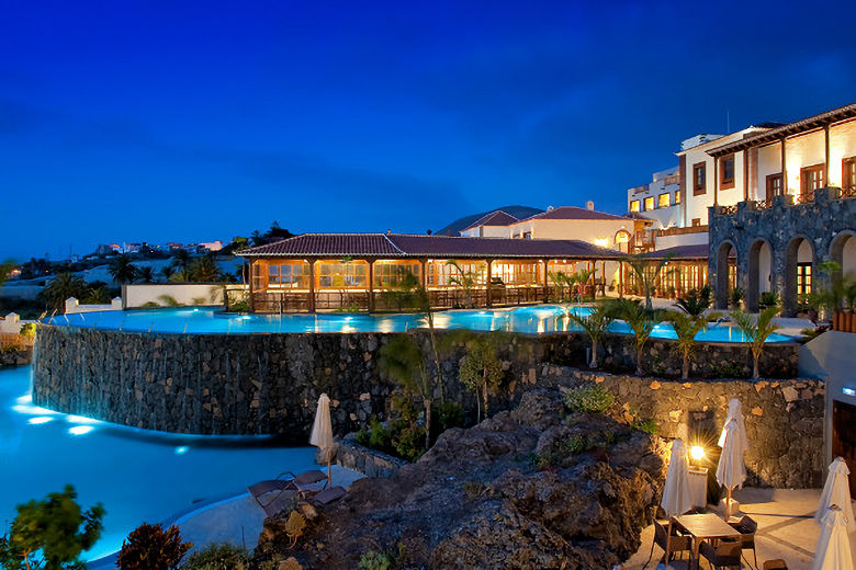 The hotel's pools in the evening