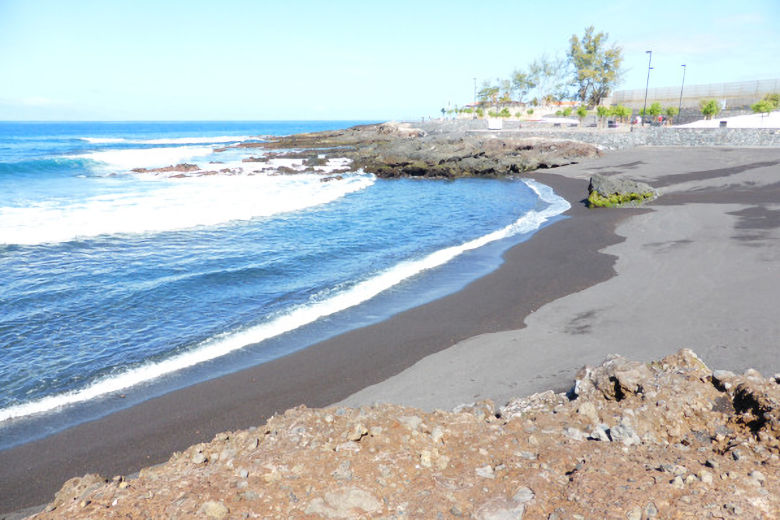 The nearby volcanic beach