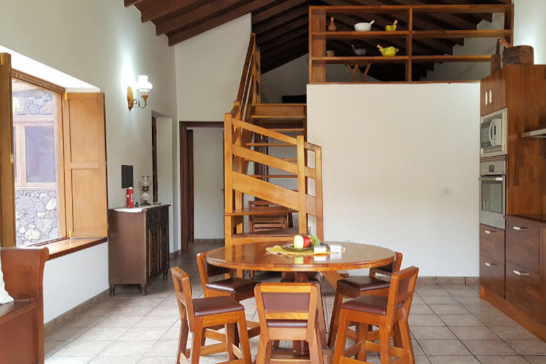 Dining area and stairs leading to lounge area