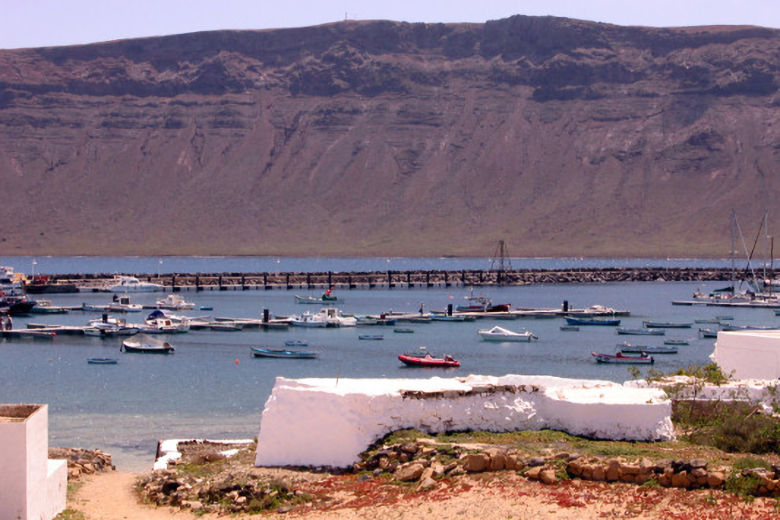 View of Lanzarote's Famara cliffs from La Graciosa's harbour