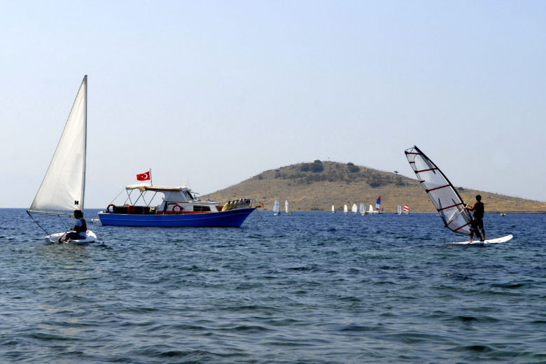 Surfing and sailing in the bay