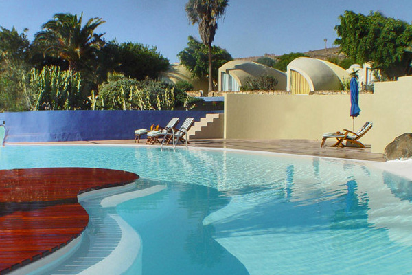 One of the hotel's pools, with some of the suites in the background
