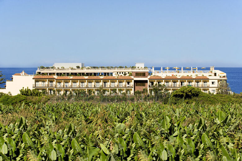 The hotel is backed by banana plantations