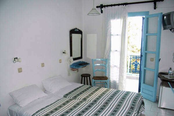Guest rooms furnished in classic Greek style