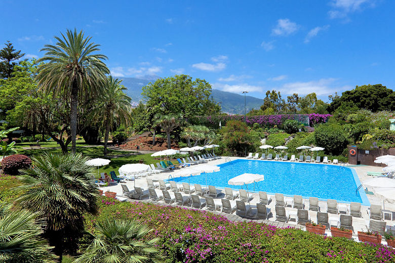 The hotel's pool and mature gardens