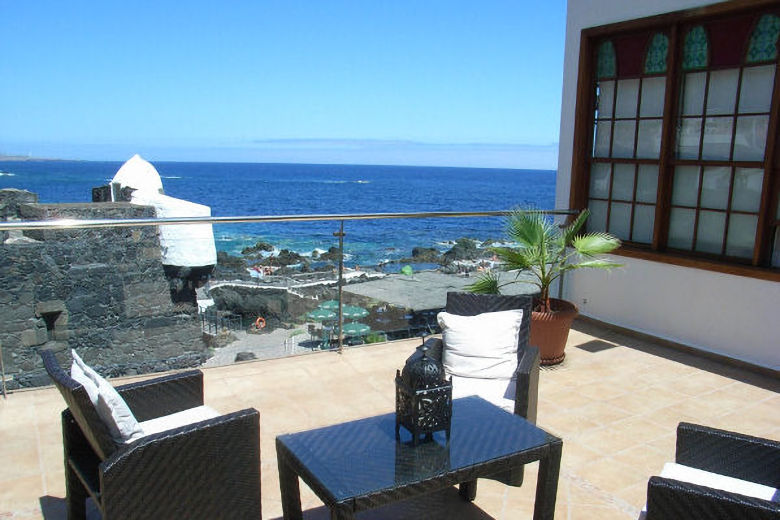 The upper floor terrace overlooking the castillo and the natural rock pools
