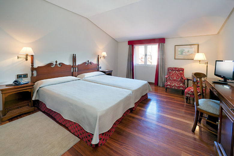 Comfortably furnished guestrooms with wooden floors